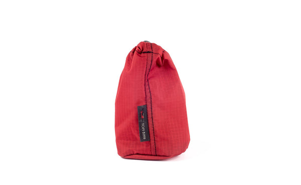 A Size 1 Sangria (red with light red grid) 210 Cerylon Travel Stuff Sack.